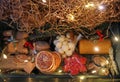 A Christmas gift made of honey, homemade gingerbread candies, nuts, dried oranges. Soft focus