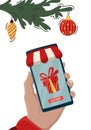 Christmas gift online shopping concept. Ordering gifts online from home. Huge Gift Box Present in Smartphone Screen. Christmas