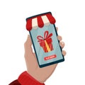 Christmas gift online shopping concept. Ordering gifts online from home. Huge present box in smartphone screen. Christmas shopping