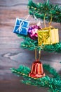 Christmas gift ornaments hang on Christmas Tree have space wood background Royalty Free Stock Photo