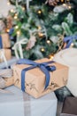 Christmas gift or present box wrapped in kraft paper on christmas decoration Royalty Free Stock Photo