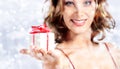 christmas gift present, woman with package on blurred bright lig Royalty Free Stock Photo