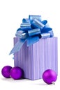 Christmas gift with Purple Ball and ribbon bow Royalty Free Stock Photo