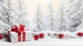 Christmas gift with red ribbons, balls and baubles on snow covered surface. Royalty Free Stock Photo