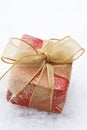 Christmas gift with red wrapping and bow. Royalty Free Stock Photo