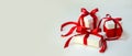 Christmas Gift`s in White Box with Red Ribbon on Light Background. New Year Holiday Composition Banner. Copy Space For Your Text Royalty Free Stock Photo
