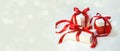 Christmas Gift`s in White Box with Red Ribbon on Light Background. New Year Holiday Composition Banner. Copy Space For Your Text Royalty Free Stock Photo