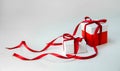 Christmas Gift`s in White Box with Red Ribbon on Light Background. New Year Holiday Composition. Copy Space Royalty Free Stock Photo