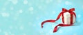 Christmas Gift`s in White Box with Red Ribbon on Light Blue Background. New Year Holiday Composition Banner. Copy Space Royalty Free Stock Photo