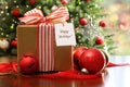 Christmas gift sitting on a table Royalty Free Stock Photo