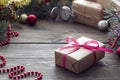 Christmas gift tied red Lenton on the table and Royalty Free Stock Photo
