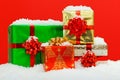 Christmas gift wrapped presents red background. Royalty Free Stock Photo