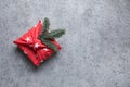 Christmas gift wrapped in red textile. Zero waste. Xmas. Furoshiki style.