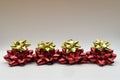 Christmas gift wrapping bows. Large glossy red and golden bows