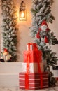 Christmas gifts on the background of the New Year`s porch Royalty Free Stock Photo