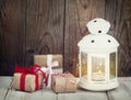 Christmas gifts and candle Royalty Free Stock Photo