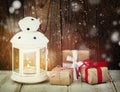 Christmas gifts and candle Royalty Free Stock Photo