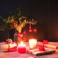 Christmas gifts, candles and fir twigs with toys, New Year concept, soft focus Royalty Free Stock Photo