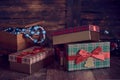 Christmas gifts and casket with Christmas toys on a wooden background.