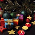 Christmas gifts, christmas tree, candles, colored decor, stars, balls on black background Royalty Free Stock Photo