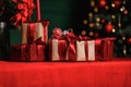 Christmas gifts in craft packaging with red ribbon Royalty Free Stock Photo