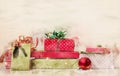 Christmas gifts decorated in green and red paper; christmas watercolor background with copy space