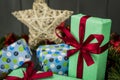 Christmas gifts packed with wrapping paper and a red bow Royalty Free Stock Photo