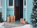 Christmas gifts in front of the front door. Delivery of a gift for the holiday