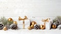 Christmas gifts with golden ribbons, balls and baubles on snow covered surface. Royalty Free Stock Photo