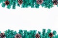 Christmas background with fir tree and pine cones on white table. Top view with copy space Royalty Free Stock Photo