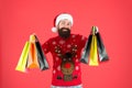 Christmas gifts. Presents for family. Santa is coming. Bearded hipster carry shopping bags. Packages with gifts. Happy Royalty Free Stock Photo