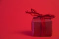 Christmas gifts presents on red background. Simple, classic, red and white wrapped gift boxes with ribbon bows and Royalty Free Stock Photo