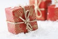 Christmas gifts with red wrapping and bows. Royalty Free Stock Photo