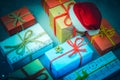 Christmas gifts and Santa`s red hat.New year, winter holiday. Royalty Free Stock Photo