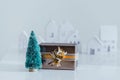 Christmas gifts with snowflakes. Small white houses Royalty Free Stock Photo