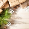 Christmas gifts with snowflakes. Small white houses. Walnuts. Royalty Free Stock Photo