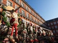 Christmas gifts sold in Plaza Mayor, main square, Madrid, Spain