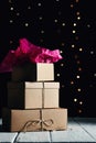 Christmas gifts stack with wrapping paper and lights