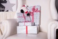 Christmas gifts stapled in a leather armchair Royalty Free Stock Photo