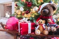 Christmas gifts and teddy bears under decorated Christmas tree. Royalty Free Stock Photo