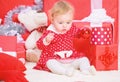 Christmas gifts for toddler. Things to do with toddlers at christmas. Little baby girl play near pile of gift boxes Royalty Free Stock Photo