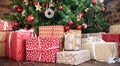 Christmas gifts under the Christmas tree red and wooden toys brick wall. new year 2019 Royalty Free Stock Photo