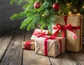 Christmas gifts under Christmas tree on rustic wooden floor