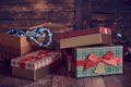 Christmas gifts and casket with Christmas toys on a wooden background.
