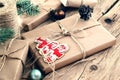 Christmas gifts on wooden table closeup. Rural or wooden style