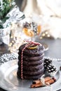 Christmas card ginger breads, and cookies on silver plate, black table, cinnamon