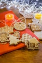 Christmas ginger cookies on a red and wooden background Royalty Free Stock Photo