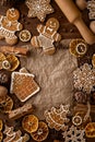 Christmas ginger cookies. Still life on a table with rolling pin, cloves, dried citrus, pine nuts and cones and kraft paper