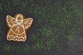 Christmas gingerbread cookie in shape of angel, green topping, holiday cookies Royalty Free Stock Photo