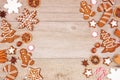 Christmas gingerbread cookies, candy and baking items, double side border on a wood background Royalty Free Stock Photo